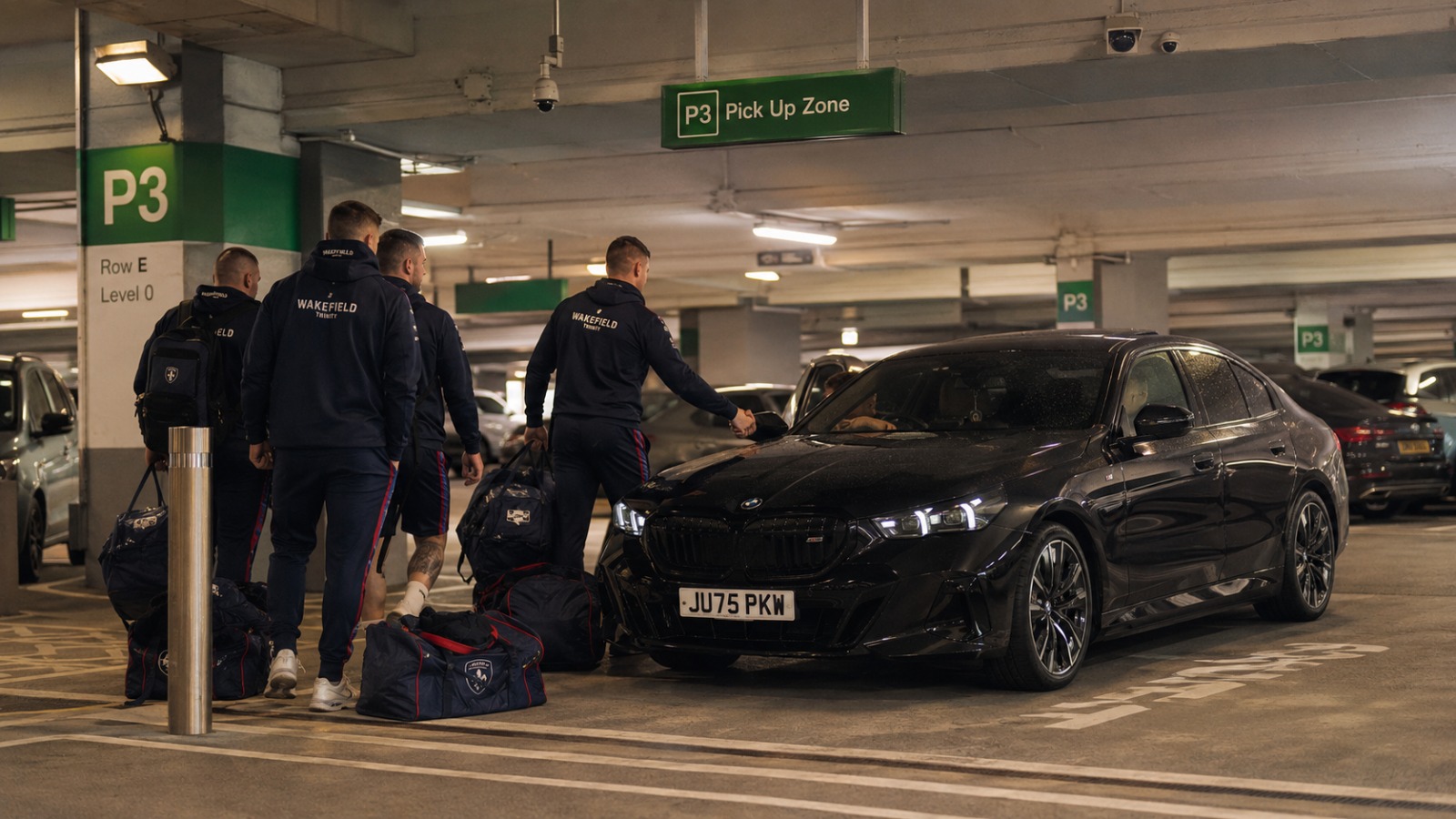 Rugby league team arriving at Manchester Airport Terminal 2 P3 for Wakefield afternoon return